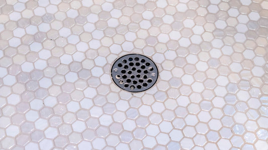 How to Clean a Shower Drain of Cement Quickly